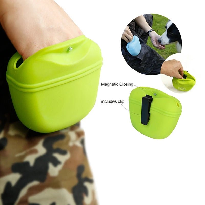 Person using a yellow compact magnetic dog treat pouch, showing easy access to treats.