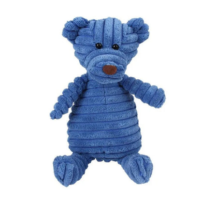 A standalone medium blue corduroy plush bear dog toy with stitched eyes and a brown nose