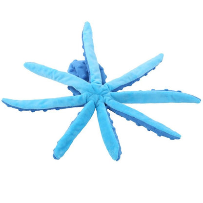 Top down studio view of a blue octopus dog toy lying flat with its eight legs spread wide out in a circle