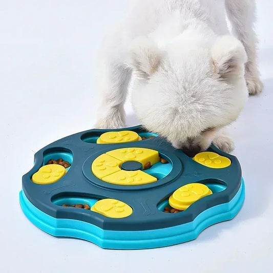 White dog using an interactive dog puzzle slow feeder toy in blue and yellow