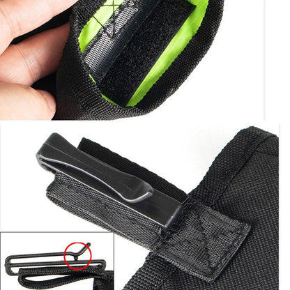 Close up view of the durable plastic belt clip attached to the back of a black dog treat bag