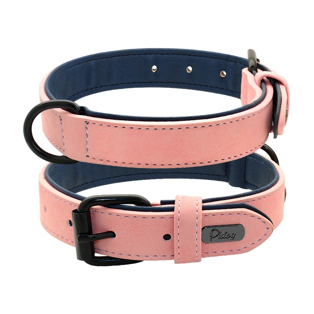 Two light pink padded faux leather collars displayed together showing buckle and outer strap texture