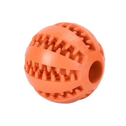 Front view of a standalone textured orange rubber dental dog ball with tooth cleaning grooves