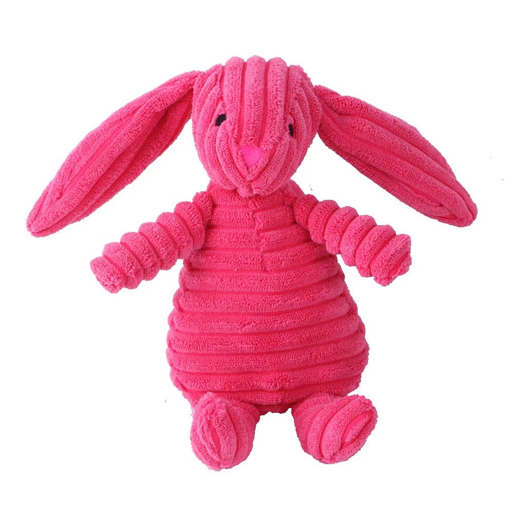 A standalone bright pink corduroy plush bunny dog toy with long floppy ears