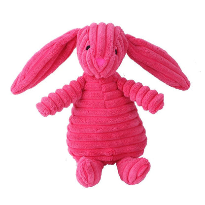 A standalone bright pink corduroy plush bunny dog toy with long floppy ears
