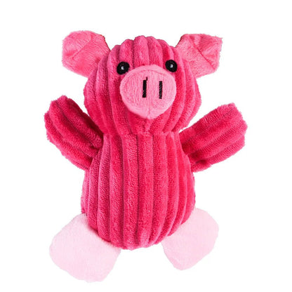 A standalone bright pink corduroy plush pig dog toy with a soft round snout