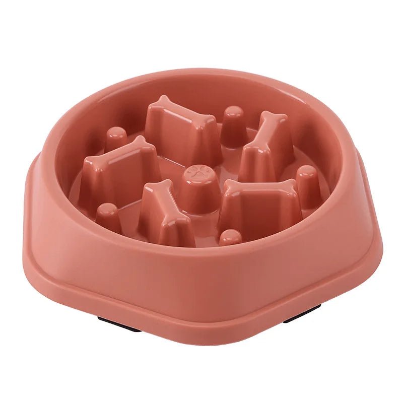 Red anti-choke slow feeder dog bowl with internal bone-shaped maze design