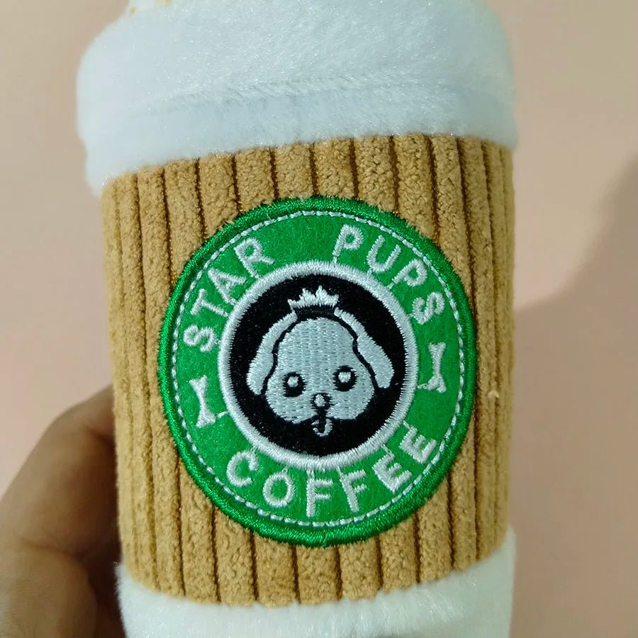 Close up of the circular green Star Pups Coffee logo with an illustrated dog face on a plush corduroy sleeve